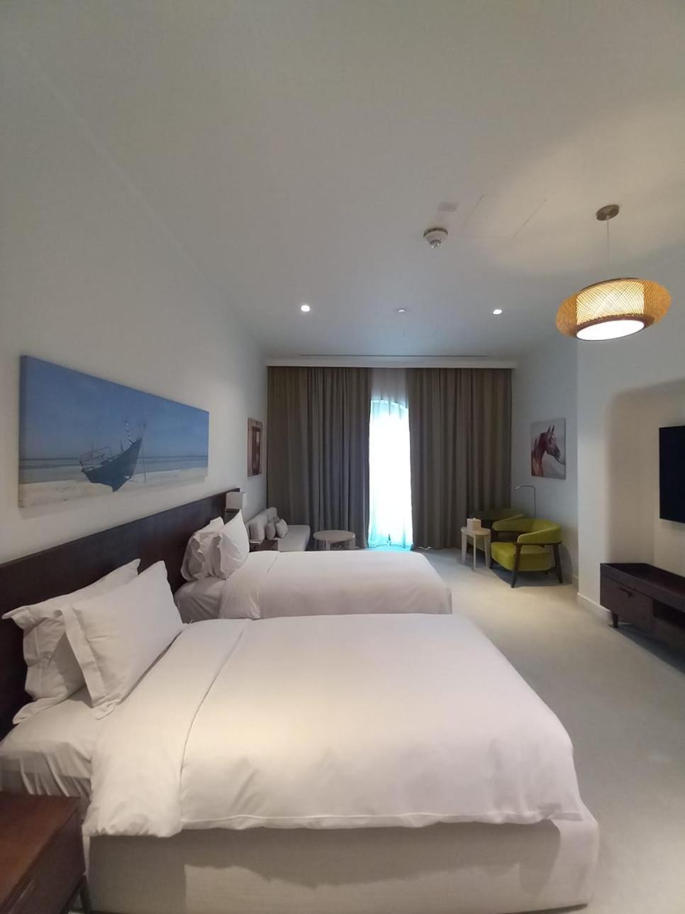Mina Hotel And Residences By The Torch Doha Exteriör bild A room at the hotel