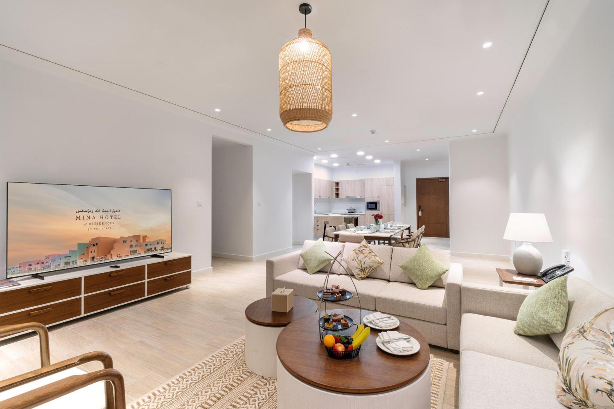 Mina Hotel And Residences By The Torch Doha Exteriör bild A living room at the Ritz-Carlton, DIFC
