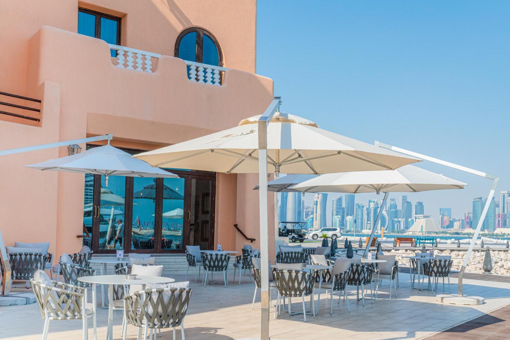 Mina Hotel And Residences By The Torch Doha Exteriör bild A patio umbrella